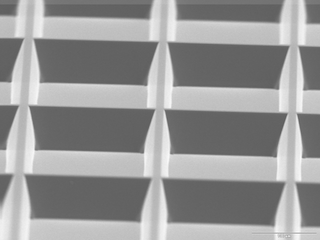 SEM-image-detail of Stencil-mask with array of recangular-frames and 15° sidewall-tapering.